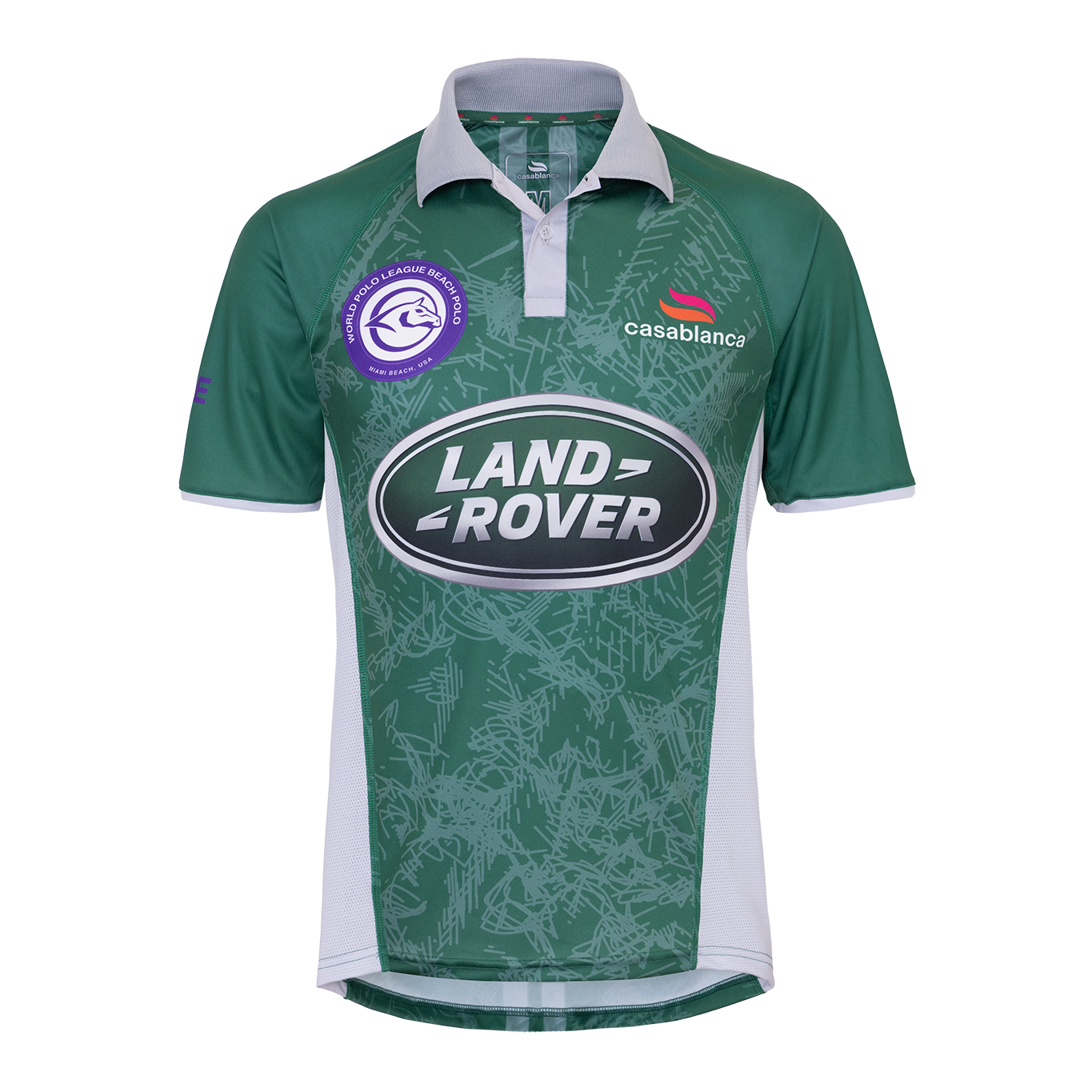 A green and white short-sleeve polojersey with a patterned design, featuring the Land Rover logo on the front, the Casablanca brand logo, and a circular team crest on the left chest.